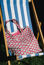 Load image into Gallery viewer, pink Arthus block print bag on blue striped deckchair