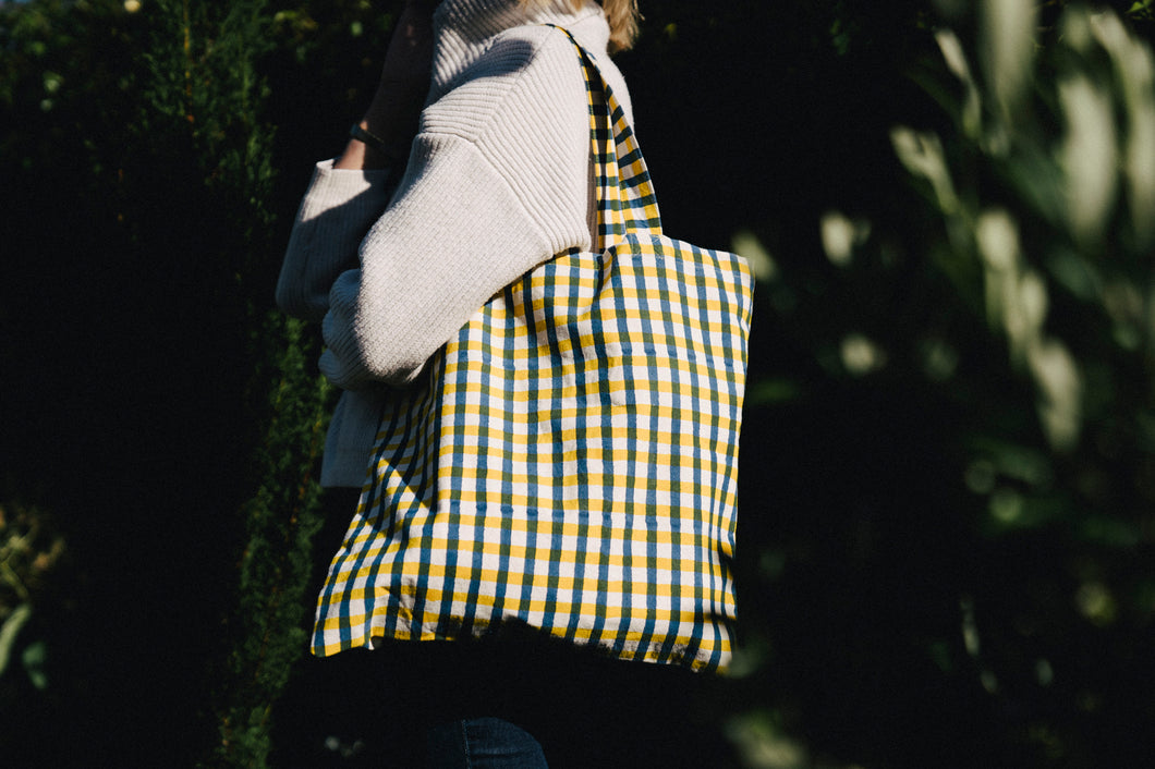 bertie block print bag with blue and yellow gingham on girl's shoulder