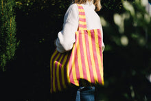 Load image into Gallery viewer, pink and yellow striped William block print bag on a girl&#39;s shoulder
